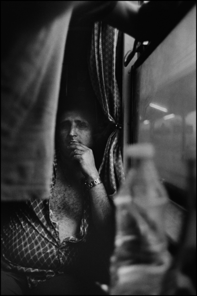 Man on train : Structured Moments : SUSAN MAY TELL: Photographs of Space, Silence & Solitude